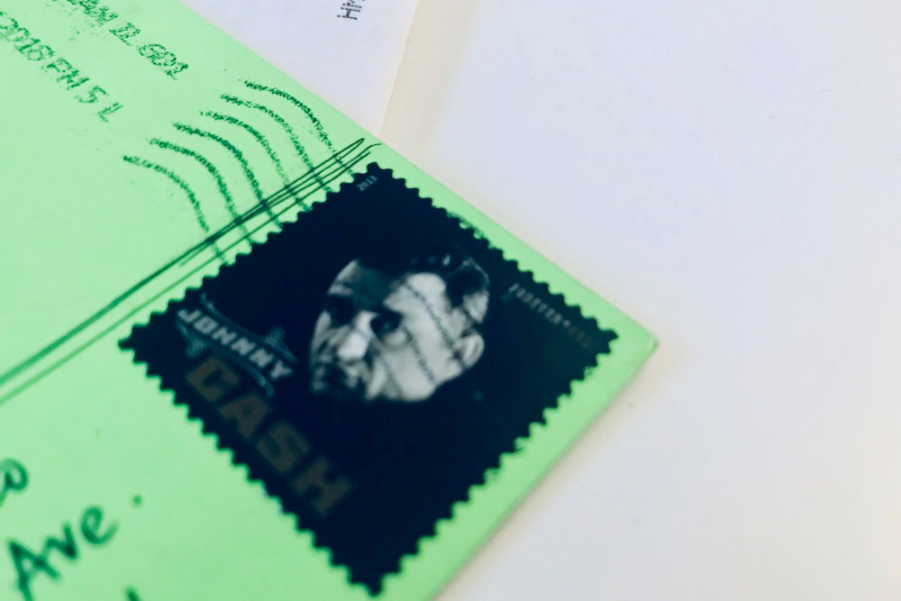 A Johnny Cash stamp on a piece of fun mail. 